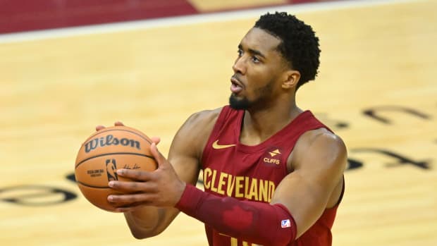 Feb 27, 2024; Cleveland, Ohio, USA; Cleveland Cavaliers guard Donovan Mitchell (45) shoots a free throw in the fourth quarter against the Dallas Mavericks at Rocket Mortgage FieldHouse.